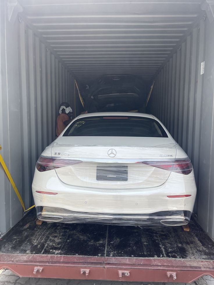 Car relocation service with protective wrapping and secure handling